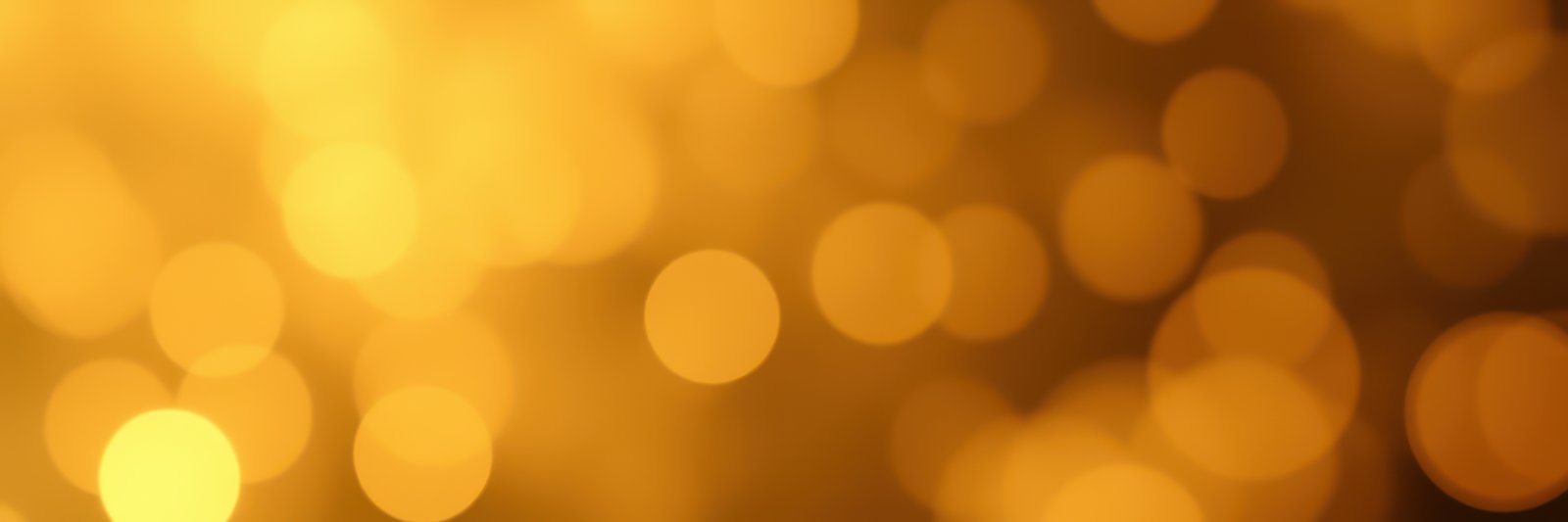 Bright golden bokeh lights create a warm atmosphere for celebrations during the evening hours